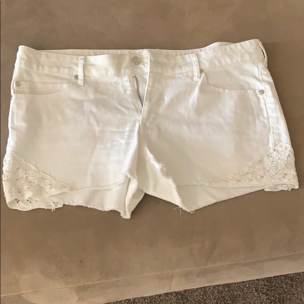 White lace trimmed mini shorts